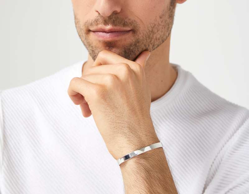 The Inner Wave Bracelet in Sterling Silver on a male