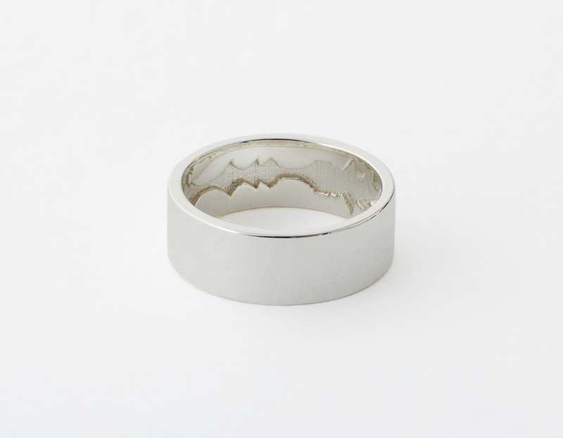The Inner Wave Ring placed horizontal in Sterling Silver