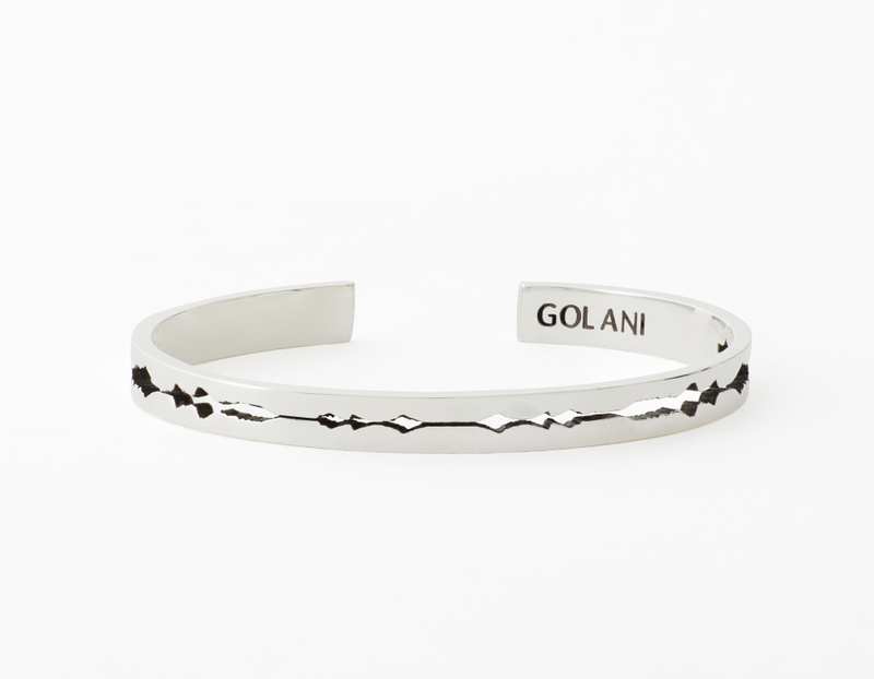The Cut Wave Bracelet placed horizontal in Antiqued Sterling Silver