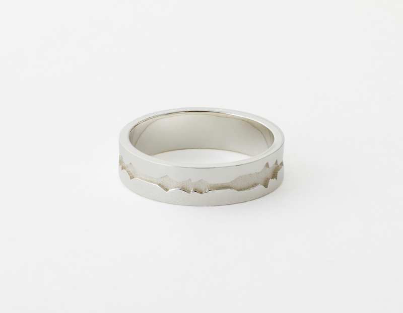 The Outer Wave Ring placed horizontal in Sterling Silver