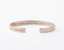 The Inner Wave Bracelet placed horizontal in Rose Gold thumbnail