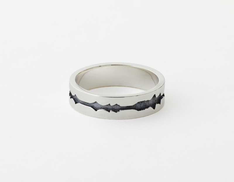 The Outer Wave Ring placed horizontal in Antiqued Sterling Silver