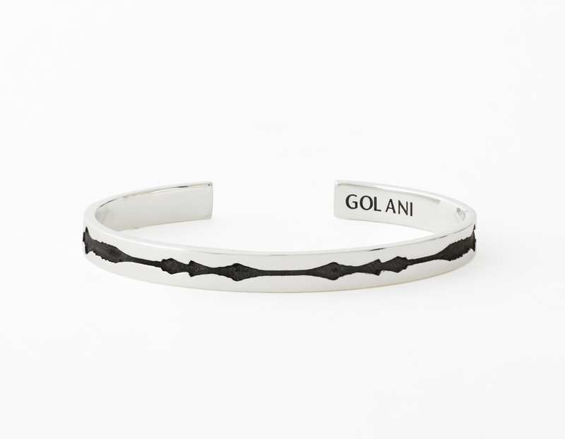 The Outer Wave Bracelet placed horizontal in Antiqued Sterling Silver