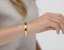Video of The Inner Wave Bracelet in 14-Karat Gold on a female thumbnail
