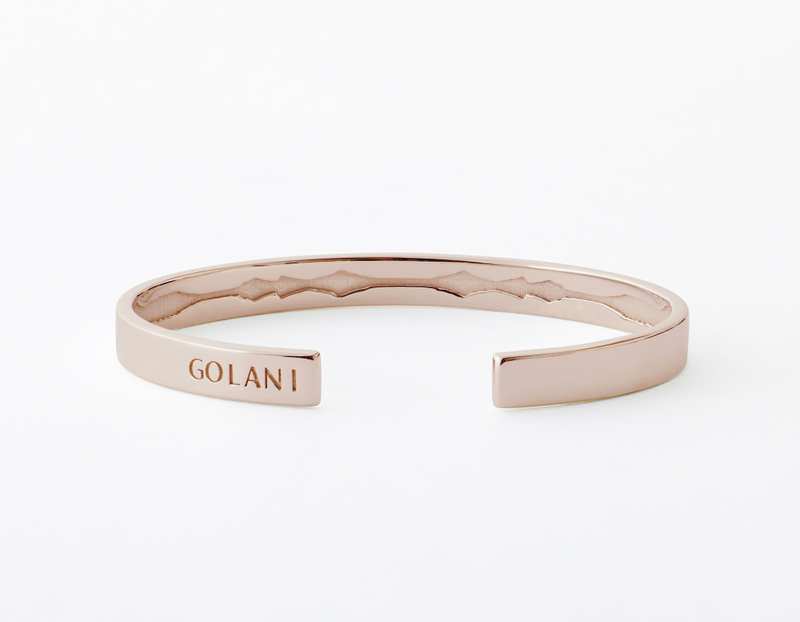 The Inner Wave Bracelet placed horizontal in Rose Gold