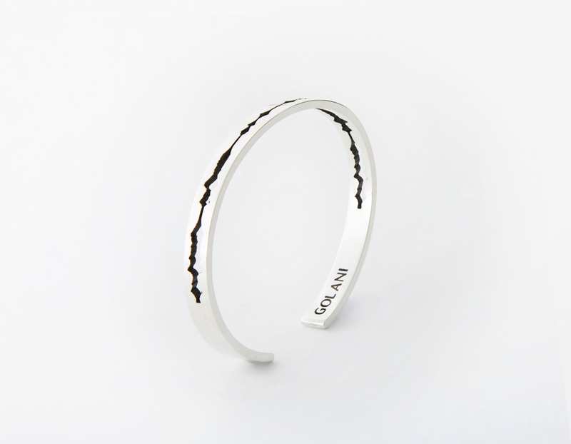 The Cut Wave Bracelet placed vertical in Antiqued Sterling Silver