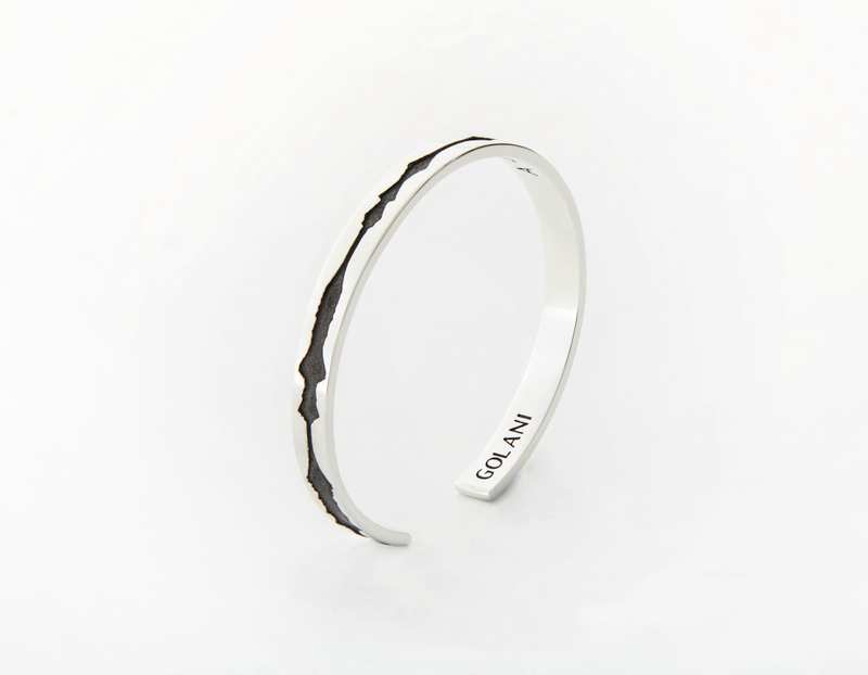 The Outer Wave Bracelet placed vertical in Antiqued Sterling Silver