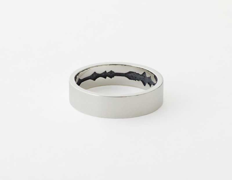 The Inner Wave Ring placed horizontal in Antiqued Sterling Silver
