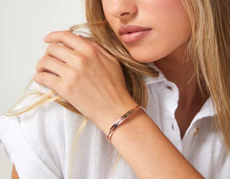 The Cut Wave Bracelet in Rose Gold on a female