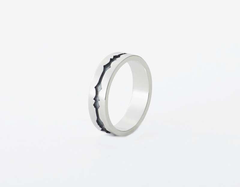 The Outer Wave Ring placed vertical in Antiqued Sterling Silver