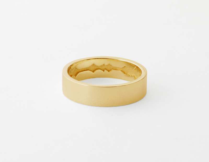 The Inner Wave Ring placed horizontal in 14-Karat Gold